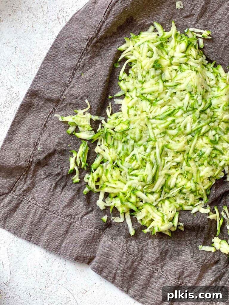 Wholesome Zucchini Oat Delights 14 process shot showing process of absorbing excess liquid from zucchini