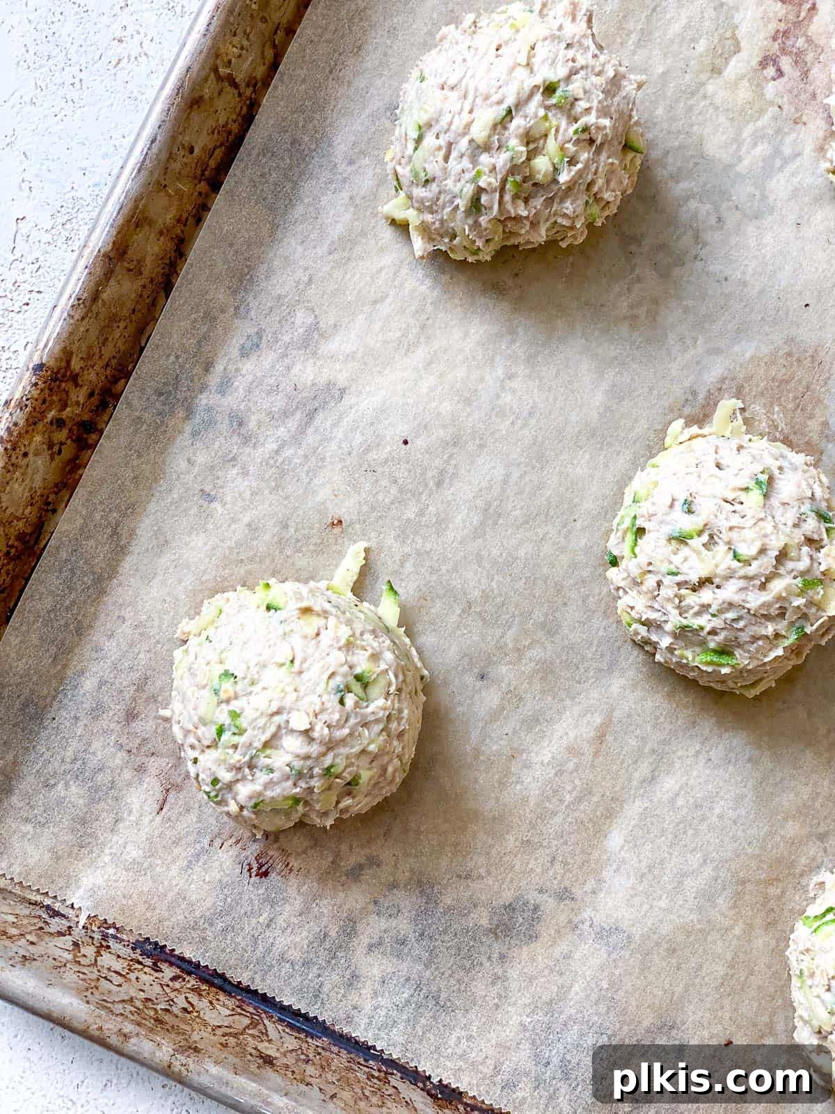 Wholesome Zucchini Oat Delights 20 process shot of added uncooked cookies to baking sheet