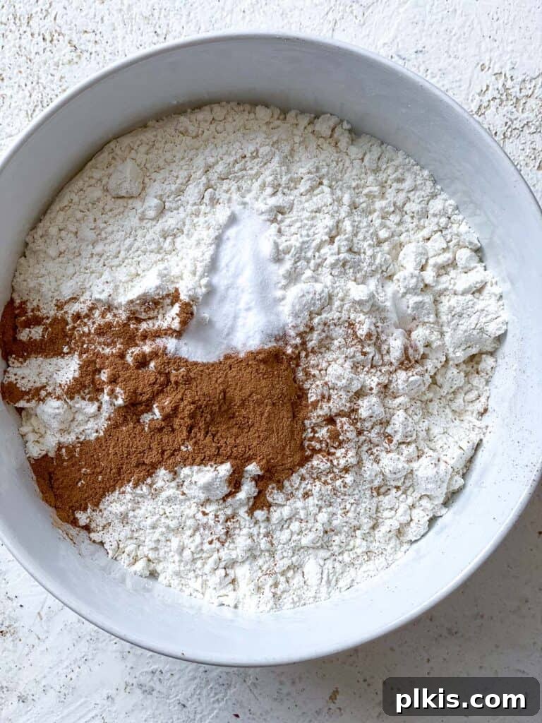 Wholesome Zucchini Oat Delights 8 process shot showing mixing of flour and spices into bowl