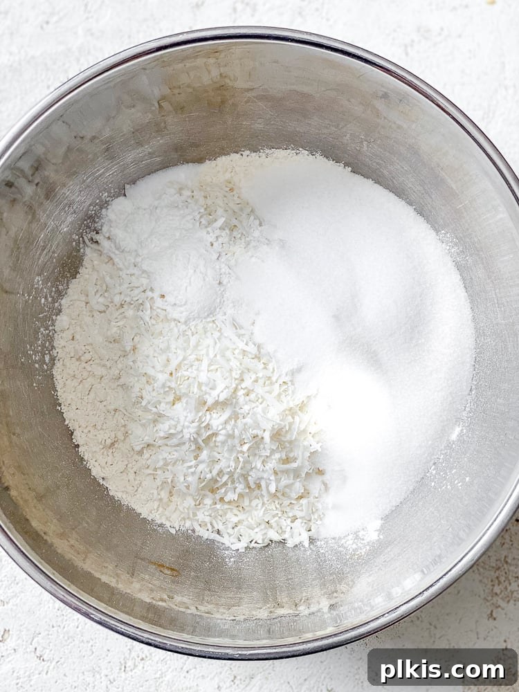 Tropical Coconut Bliss 4 Process shot showing ingredients added to a bowl.