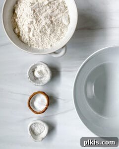 Sun-Kissed Orange Olive Oil Cake 4 All ingredients for Orange Olive Oil Cake neatly arranged on a white background before mixing.