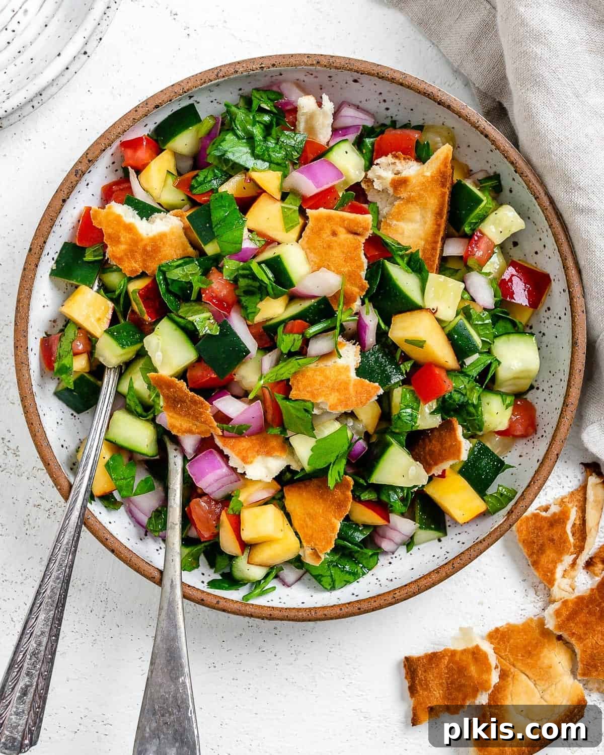 Zesty Fattoush Crunch 2 Completed Easy Summer Fattoush Salad in a white bowl against a light background