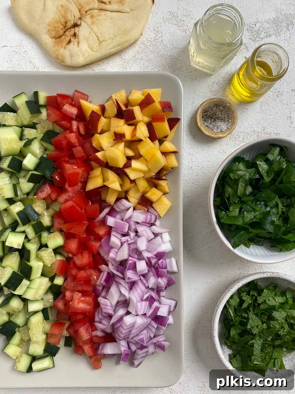 Zesty Fattoush Crunch 3 Ingredients for Easy Summer Fattoush Salad measured out and sorted in bowls and on a tray