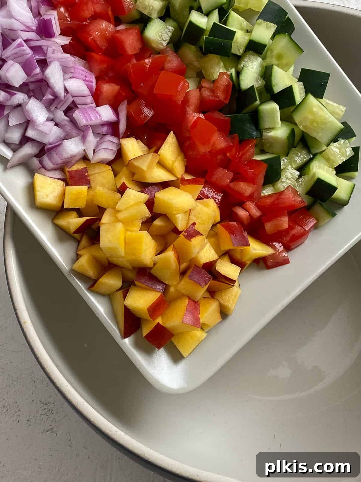 Zesty Fattoush Crunch 4 Ingredients for Easy Summer Fattoush Salad being poured into a bowl