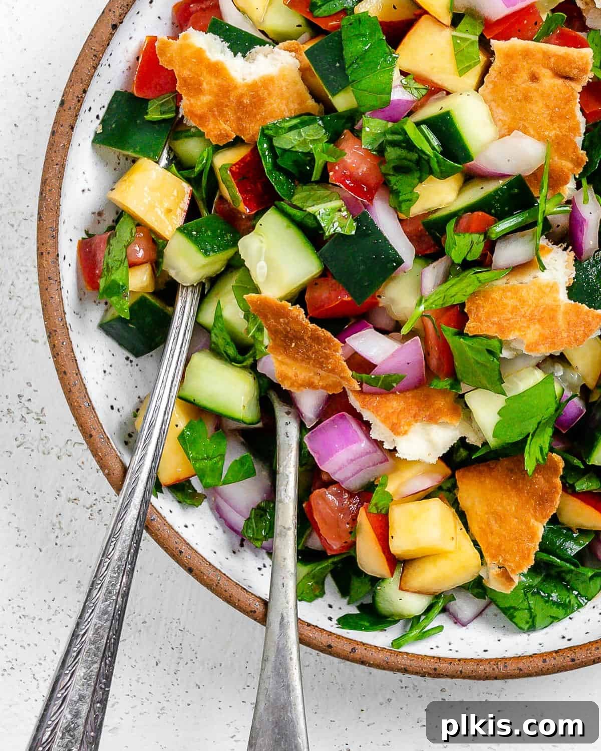 Zesty Fattoush Crunch 9 Completed Easy Summer Fattoush Salad in a white bowl against a light background