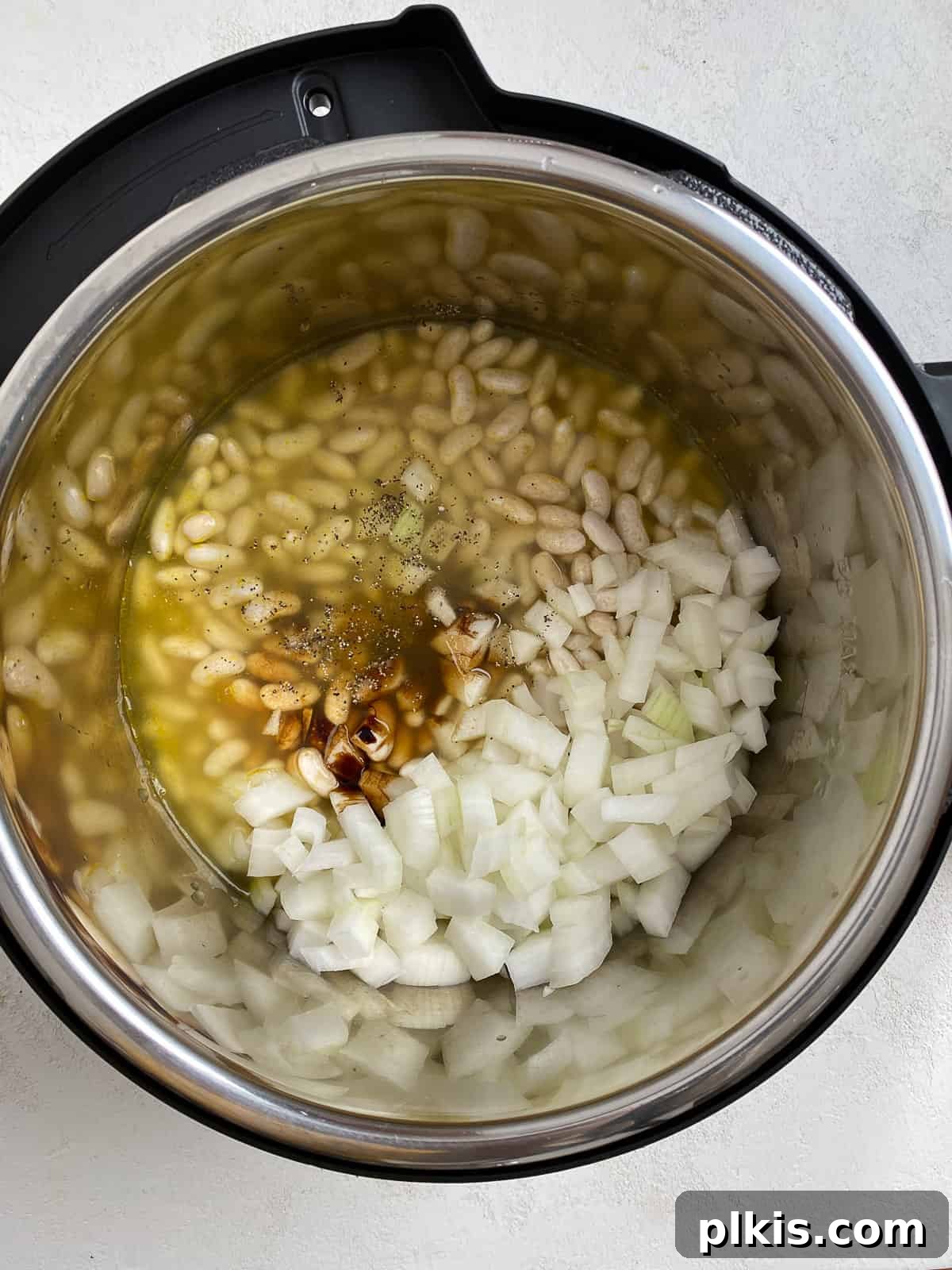 Homestyle Vegan Slow Cooker Baked Beans 7 Process shot of all ingredients for Vegan Slow Cooker Baked Beans added to the slow cooker insert, before cooking
