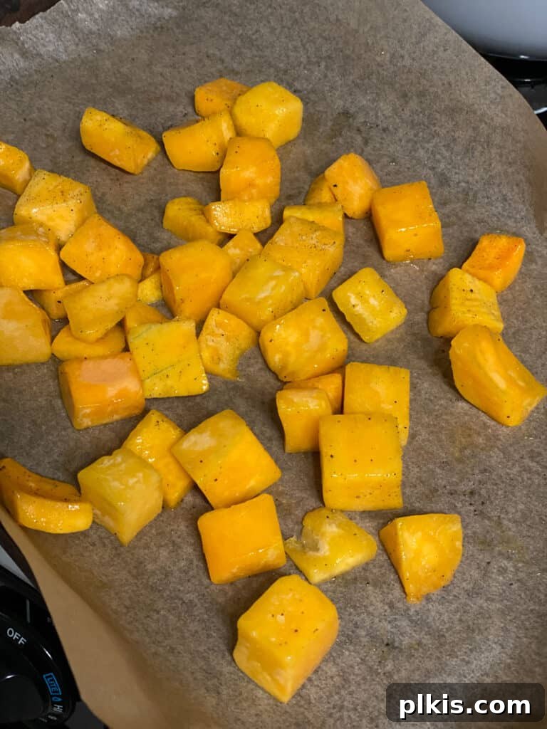 Process shot of adding chopped bell pepper to the pan with browned tempeh.