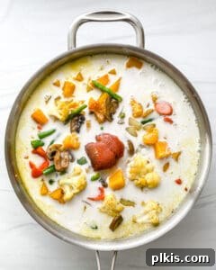 Golden Butternut Curry 8 the addition of ingredients to stainless steel pot