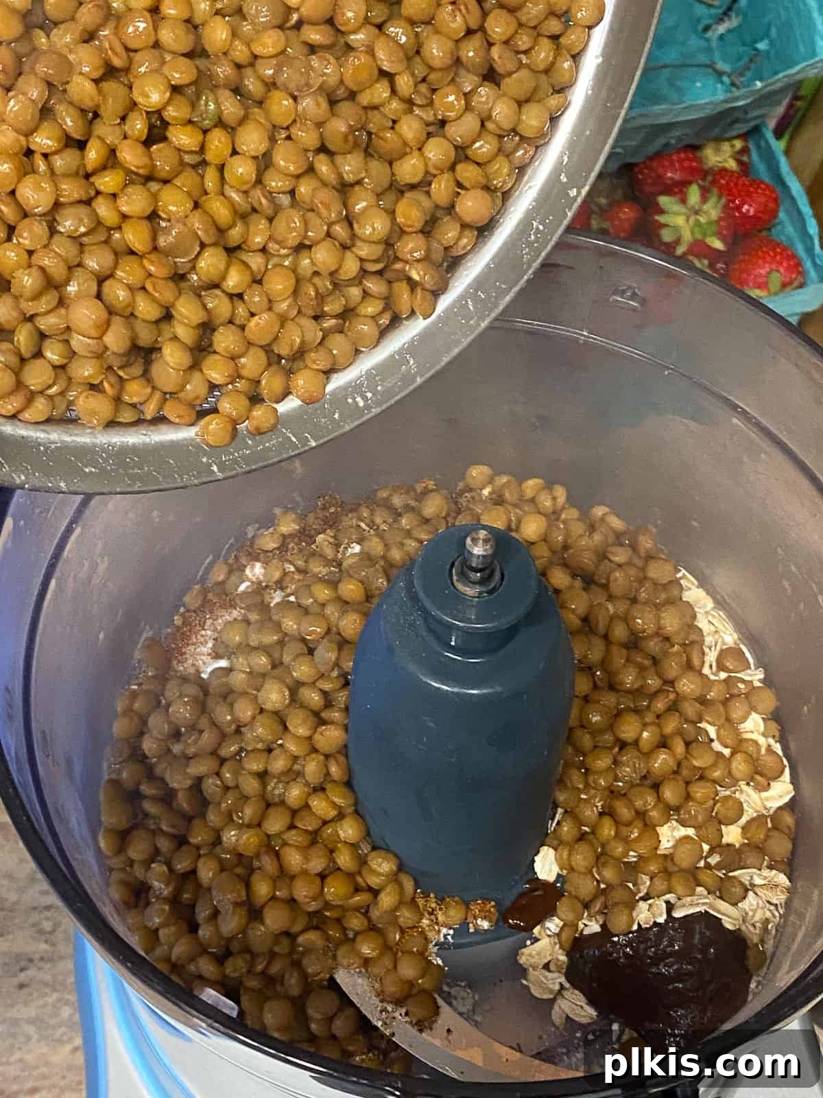 Hearty Plant-Based Lentil Street Tacos 11 process shot of adding lentils to food processor