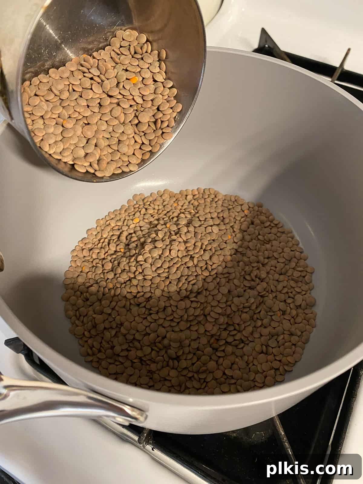 Hearty Plant-Based Lentil Street Tacos 4 process shot of adding lentils to a bowl