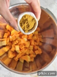 Curried Butternut Squash Roast 6 Step 3: Butternut squash being cubed on a cutting board