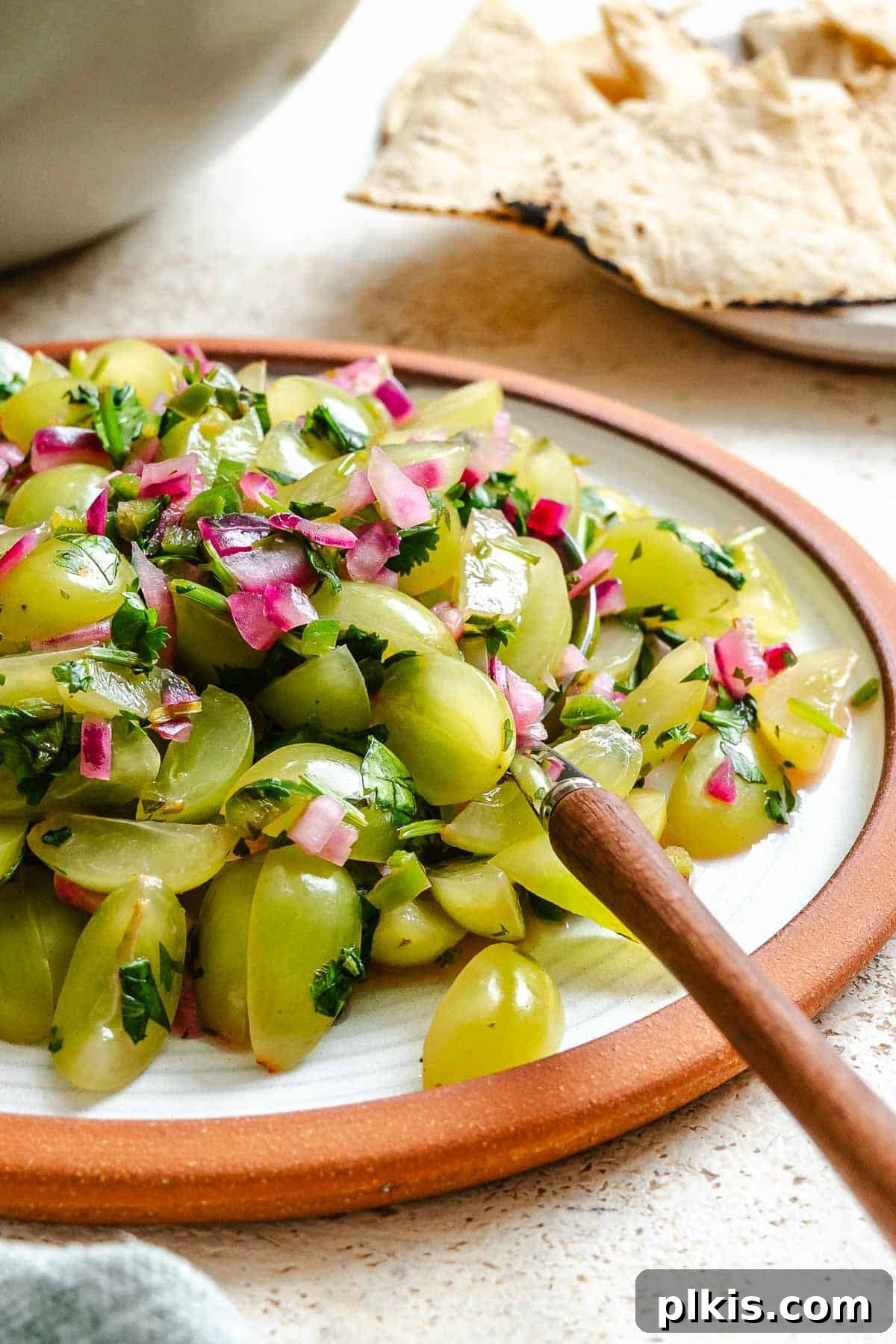 A serving of Fresh Grape Salsa in a small bowl, ready to be enjoyed as a vibrant appetizer.