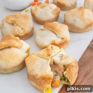 Mini vegan pot pies set out on a white board.