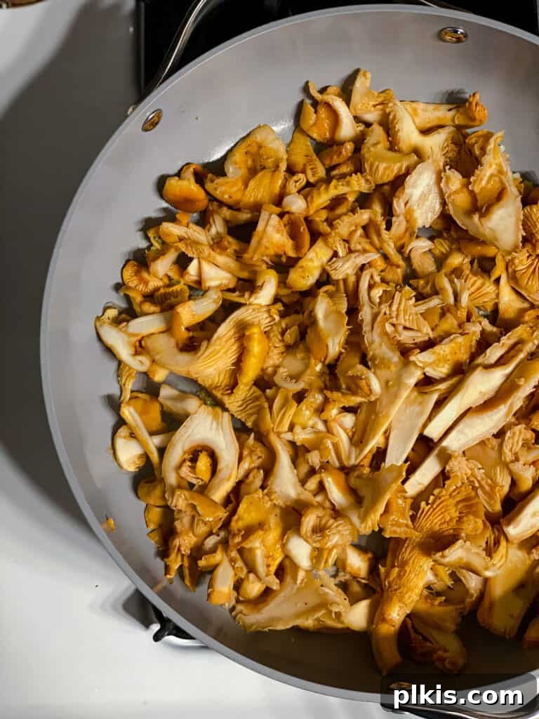 Two Tantalizing Eggplant Stacks 9 Mushrooms searing in a hot pan, developing a golden-brown crust without added oil.