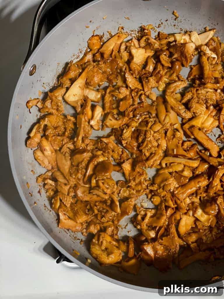 Two Tantalizing Eggplant Stacks 10 Another view of mushrooms cooking in a pan, showing the progress of browning and crisping.