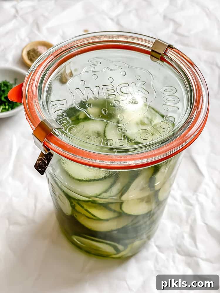 Crisp Cucumber Dill Delight 9 A sealed glass jar containing cucumber dill salad, indicating proper storage and marination.