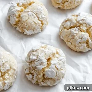 Finished Lemon Crinkle Cookies displayed beautifully on a white surface, ready to be enjoyed.