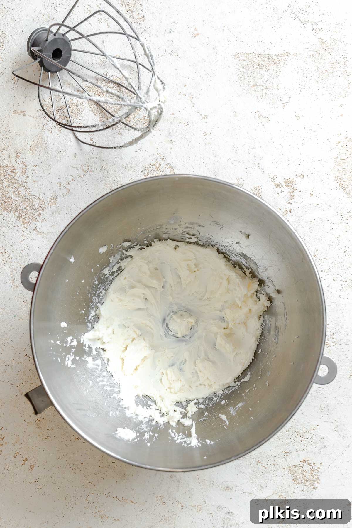 Tangy Lemon Crinkle Delights 4 A bowl filled with dry ingredients, neatly measured and ready to be combined, rests on a clean surface.