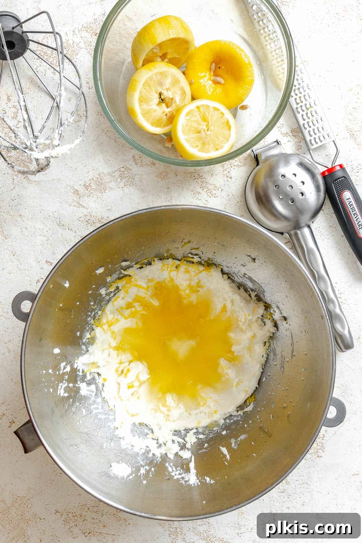 Tangy Lemon Crinkle Delights 5 Wet ingredients being creamed together in a mixing bowl, showing a smooth and fluffy texture.