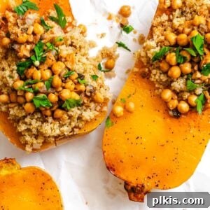 Completed Vegan Stuffed Butternut Squash on a white surface.