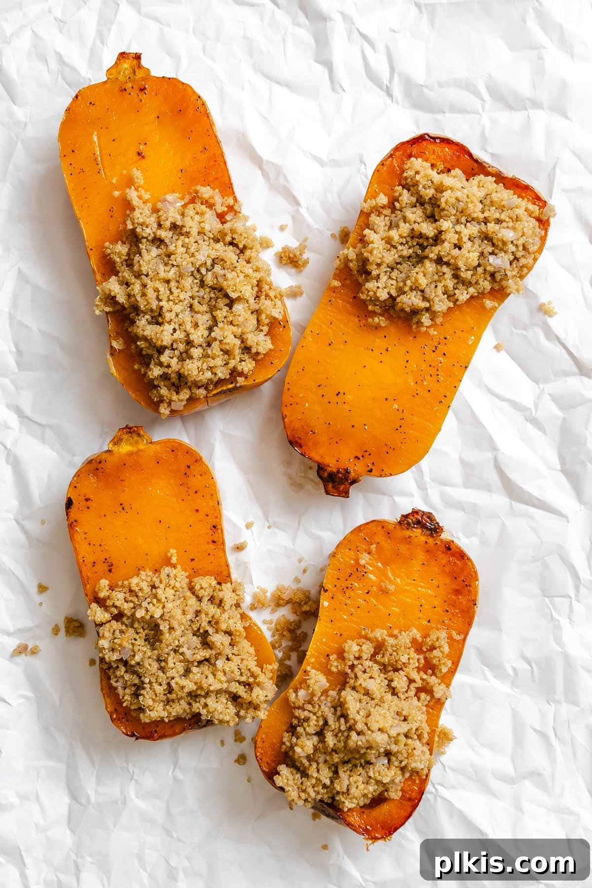 Wholesome Vegan Butternut Squash Boats 8 Process shot showing adding filling to butternut squash halves.