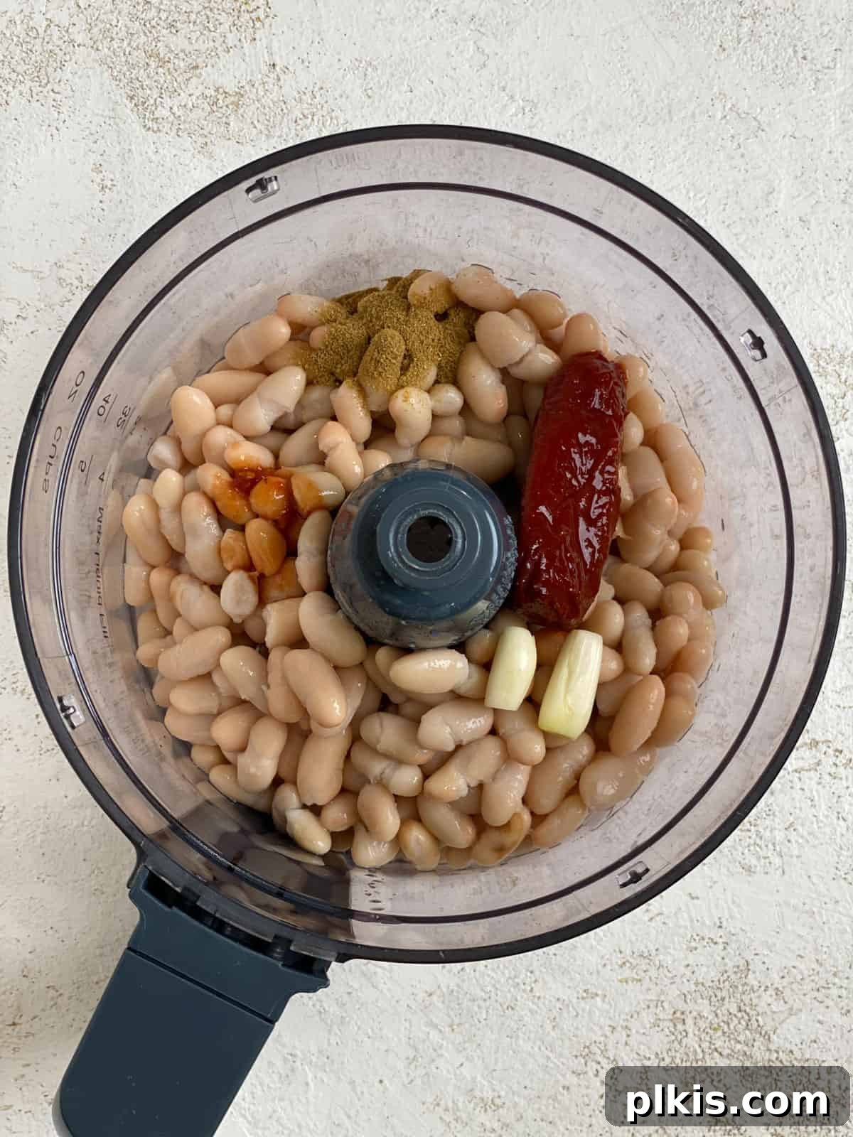 Smoky Chipotle White Bean Dip 4 process shot of Spicy Chipotle White Bean Dip ingredients added to food processor bowl