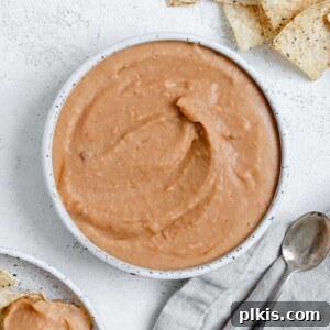 completed Spicy Chipotle White Bean Dip against a white surface