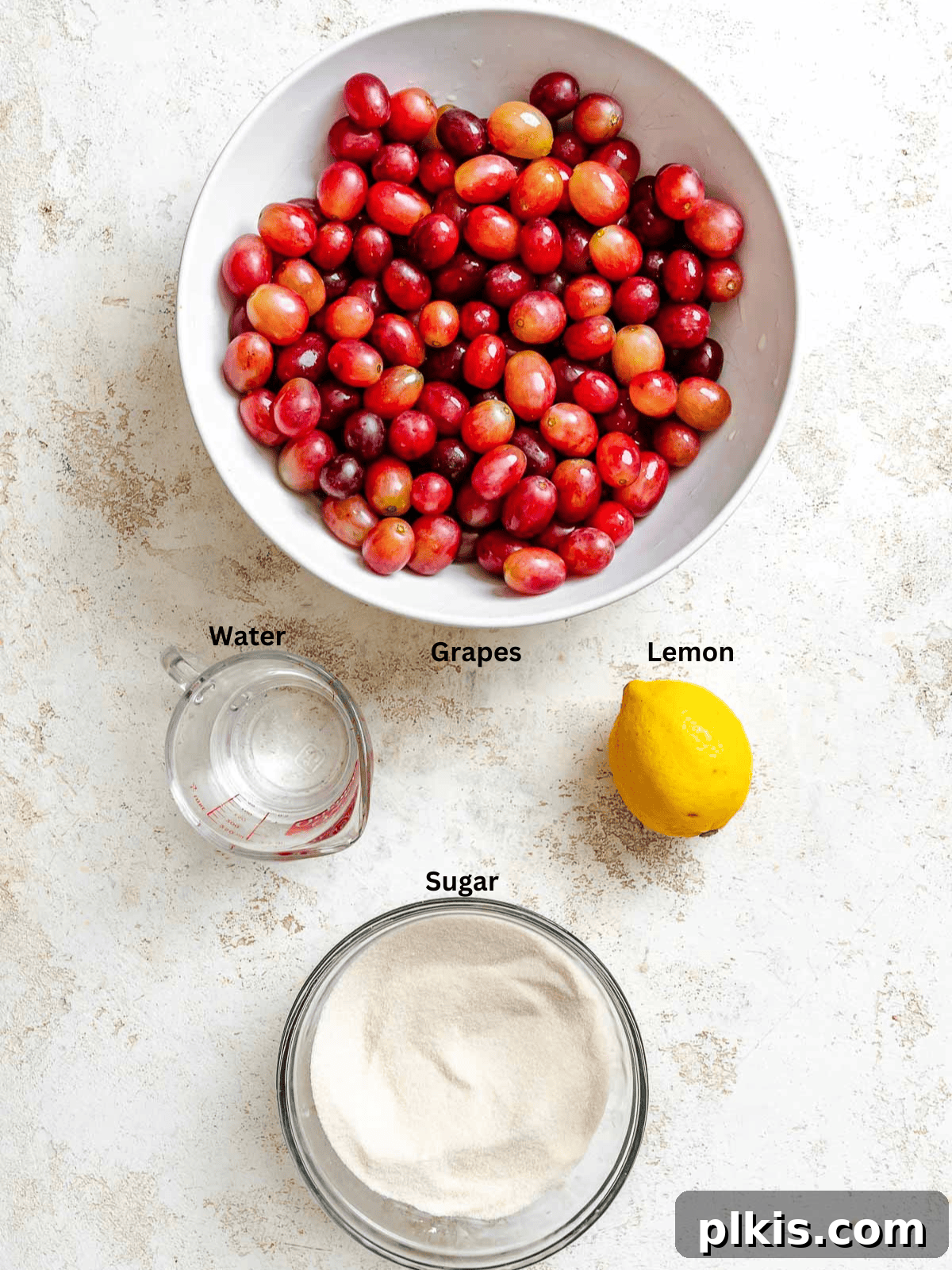 Effortless Pectin-Free Grape Jam 3 Ingredients for Easy Grape Jam (No Pectin) measured out on a white surface.
