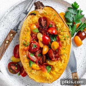 completed roasted spaghetti squash plated on a white surface