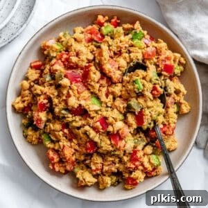 vegan garbanzo bean salad in a large white bowl.