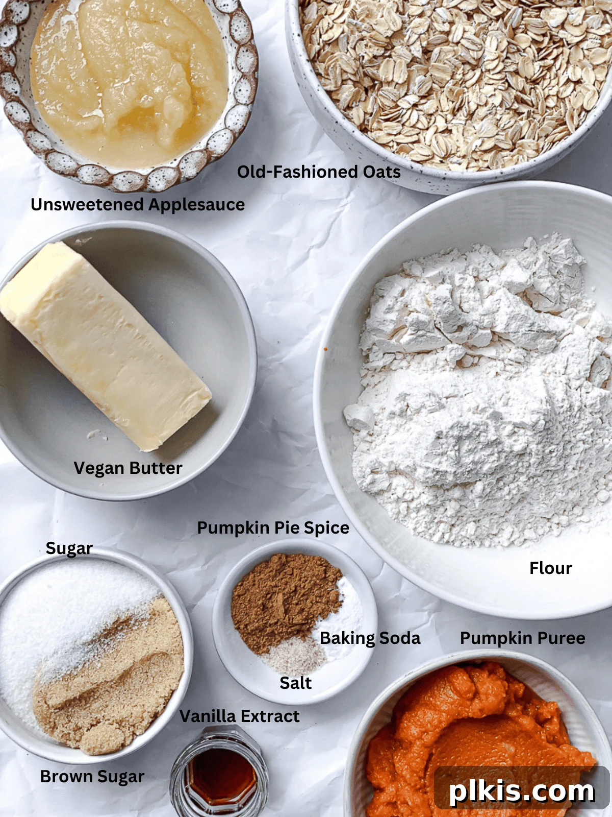 Spiced Pumpkin Oatmeal Cookies 3 All the measured ingredients for pumpkin oatmeal cookies laid out neatly on a white surface, ready for mixing and baking.