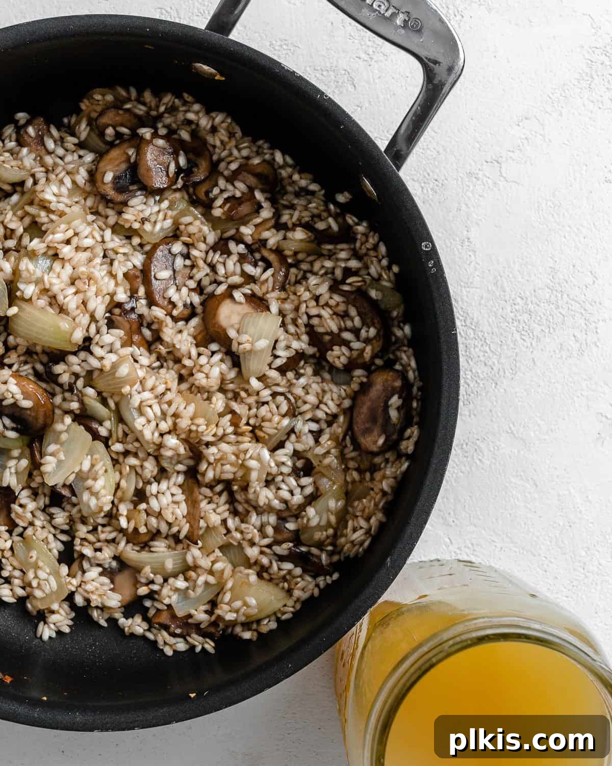 Creamy Vegan Garden Risotto 6 process shot post mixing rice and ingredients in black skillet