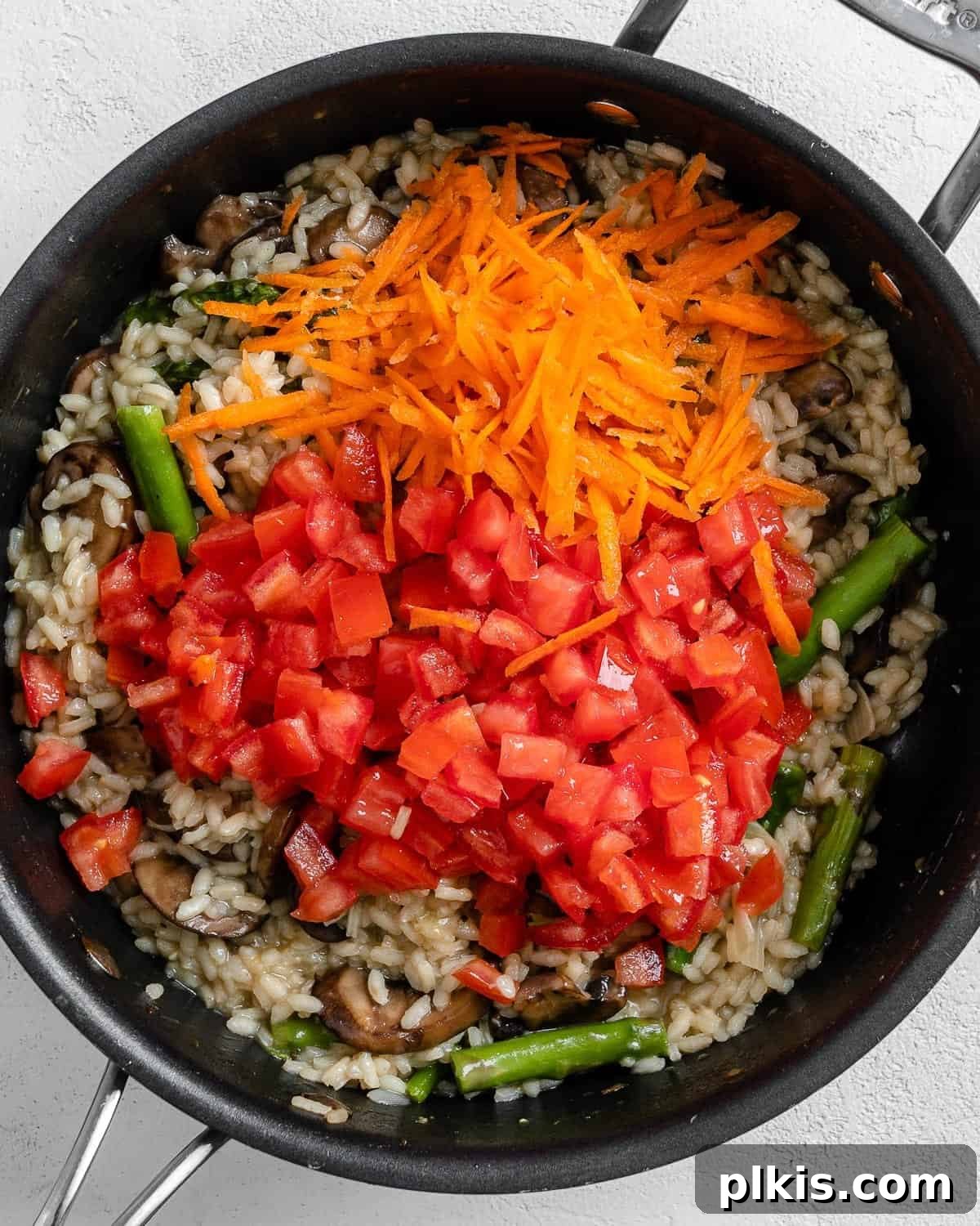 Creamy Vegan Garden Risotto 7 process shot of additional ingredients being added to black skillet