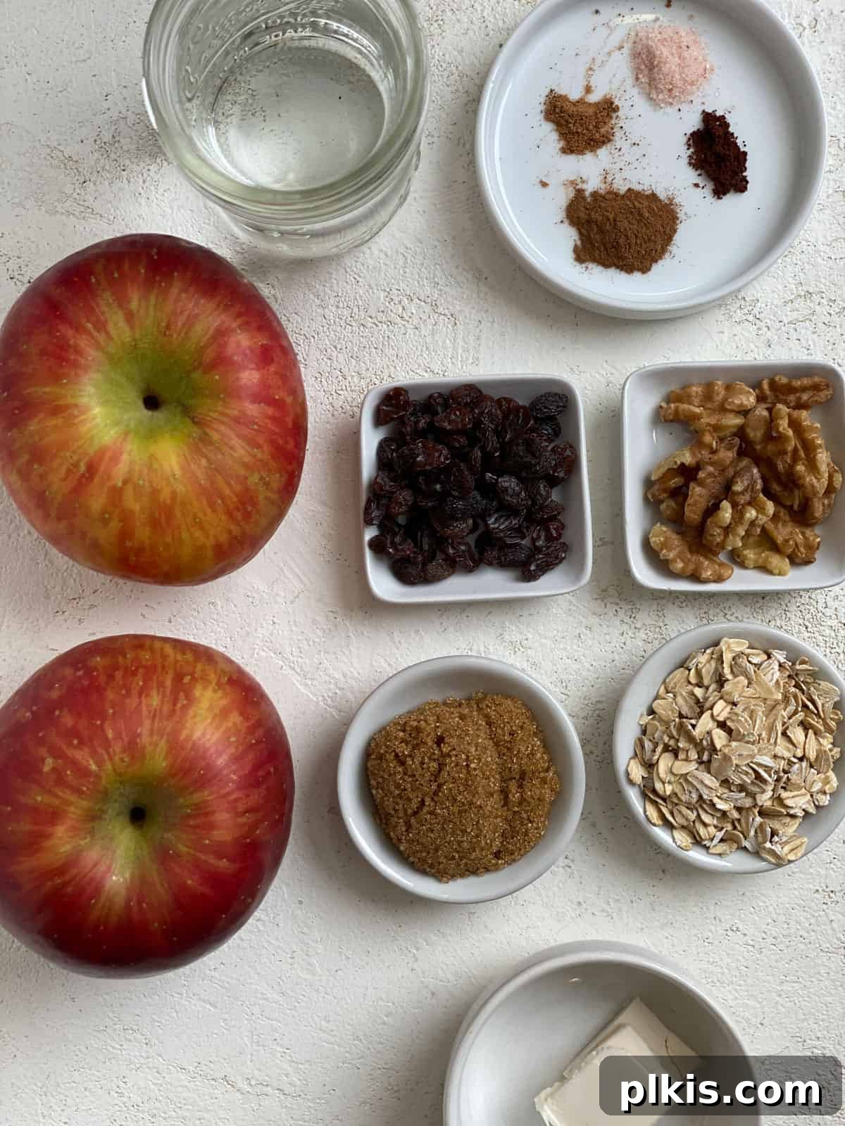 Baked Apple Delights 3 Ingredients for Stuffed Baked Apples measured out against a white surface, ready for mixing.