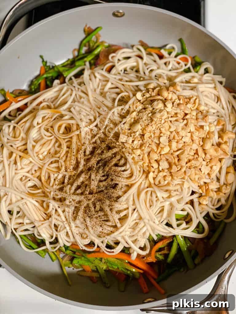 Vibrant Veggie Noodle Medley 11 process shot of added ingredients to pan