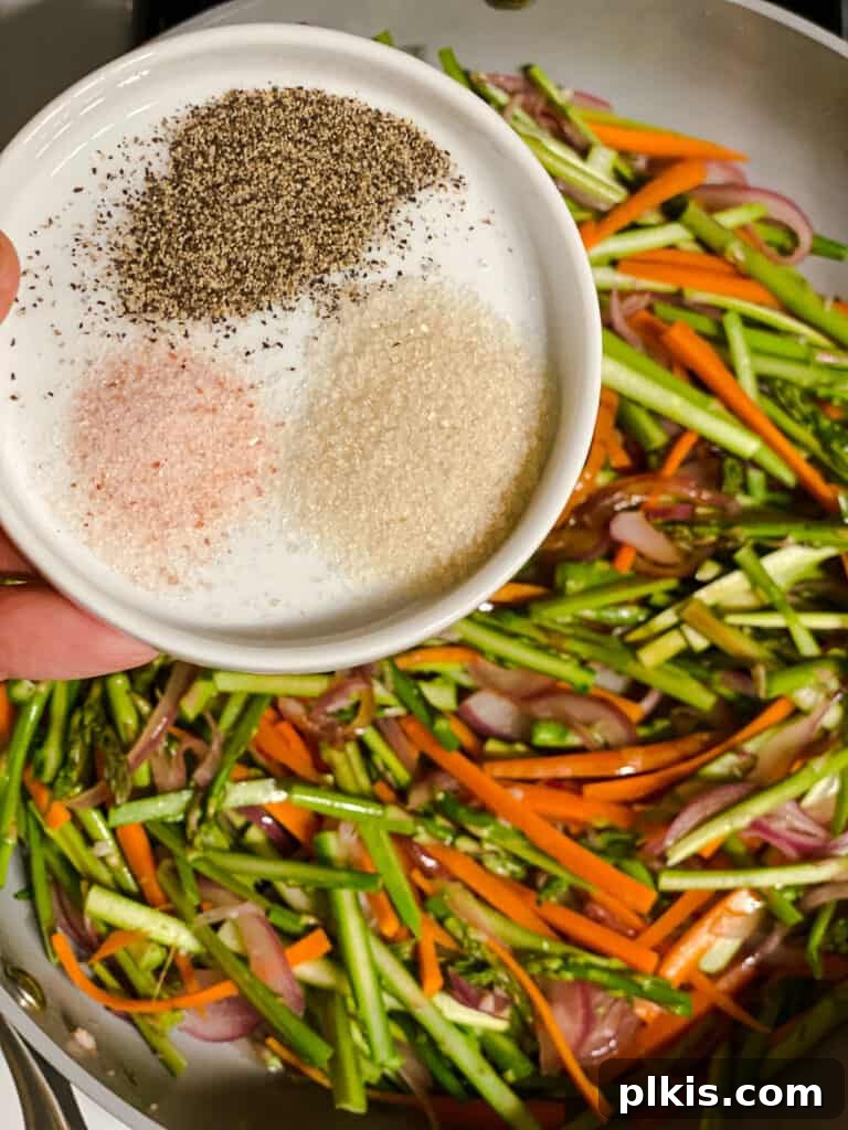 Vibrant Veggie Noodle Medley 9 process shot of adding spices to pan