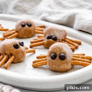 Completed Halloween peanut butter spiders on a white speckled tray
