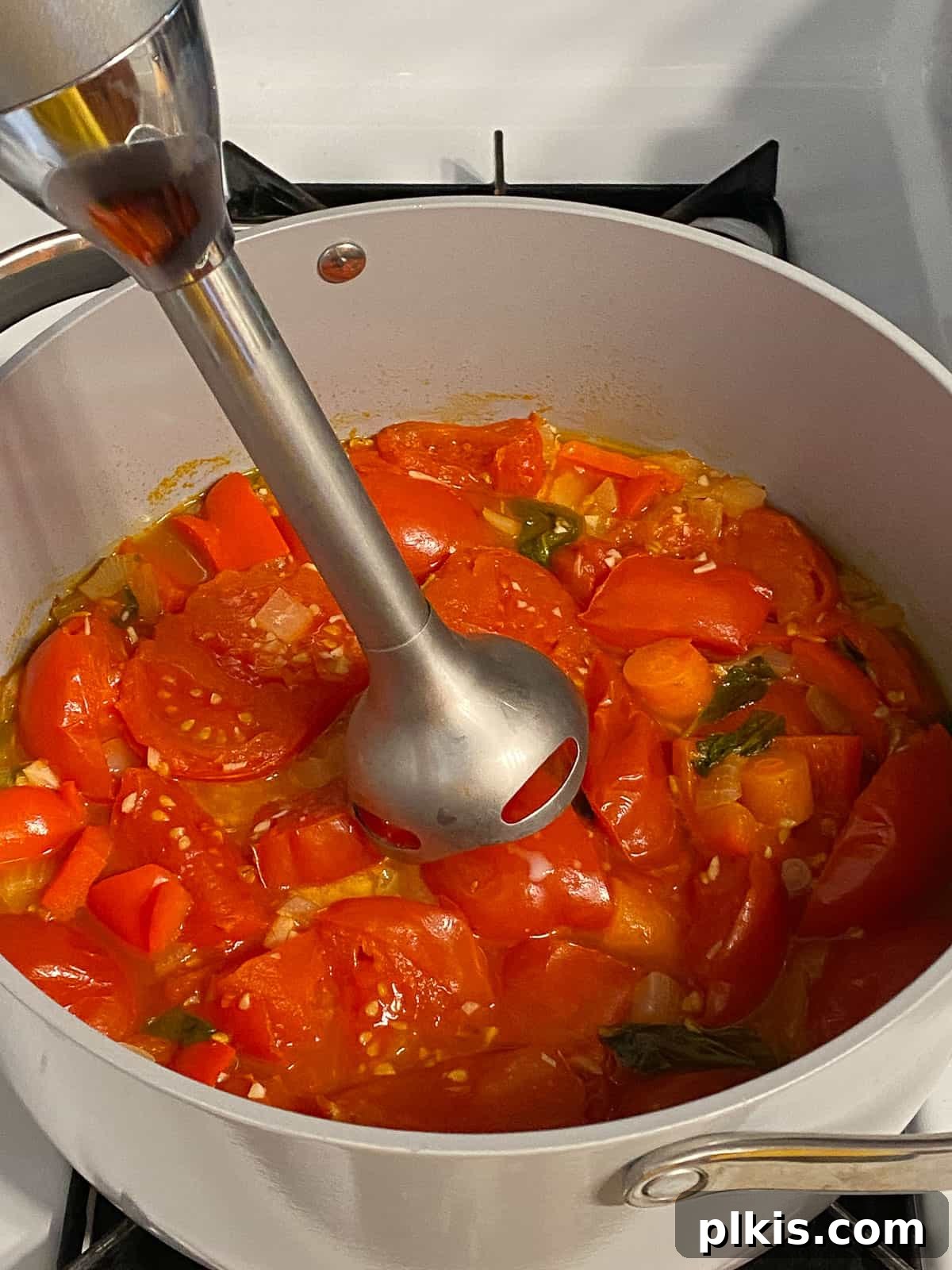 Velvety Vegan Tomato Basil Soup 13 process of using immersion blender in tomato basil soup