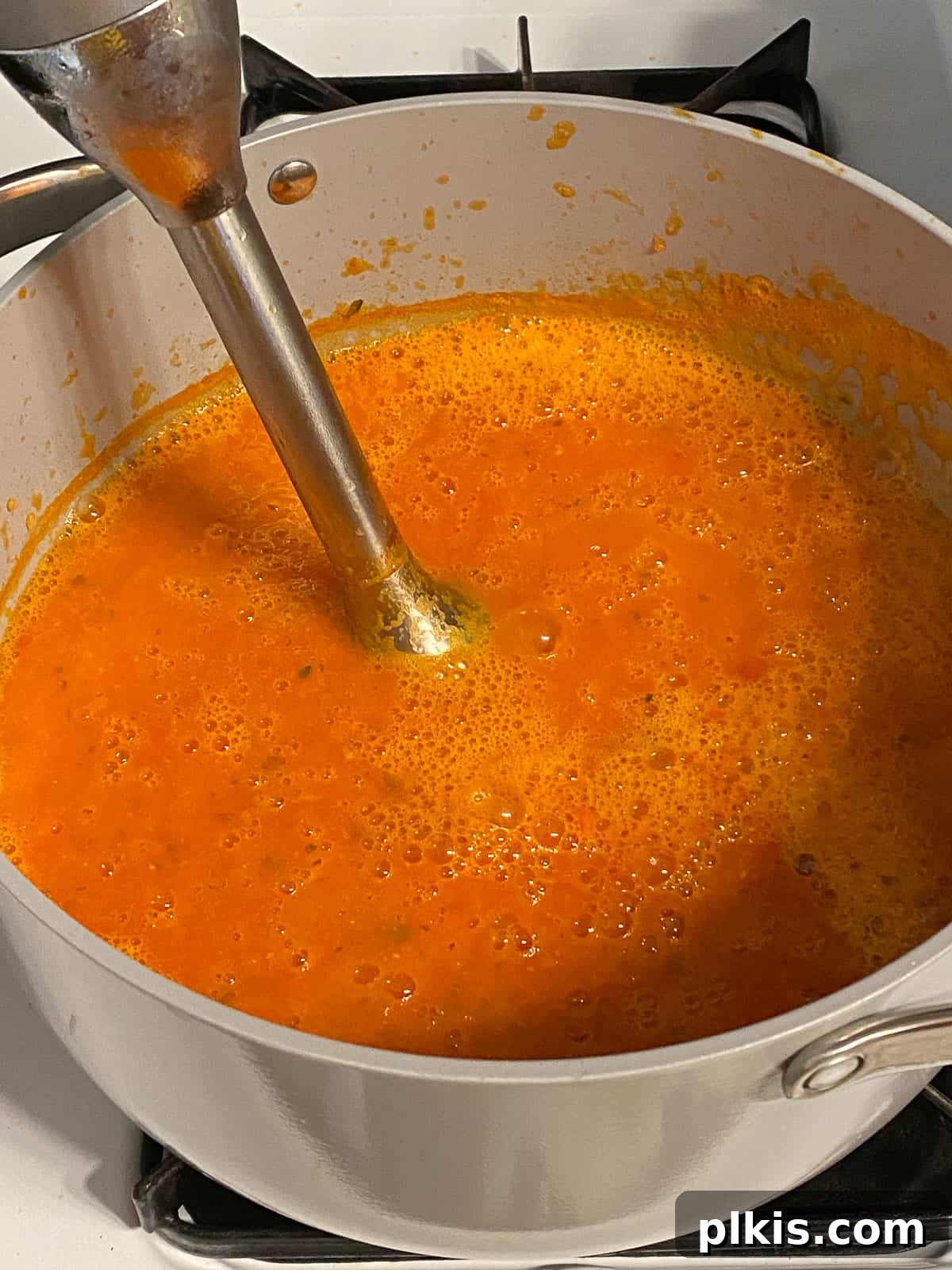 Velvety Vegan Tomato Basil Soup 14 process of using immersion blender in tomato basil soup