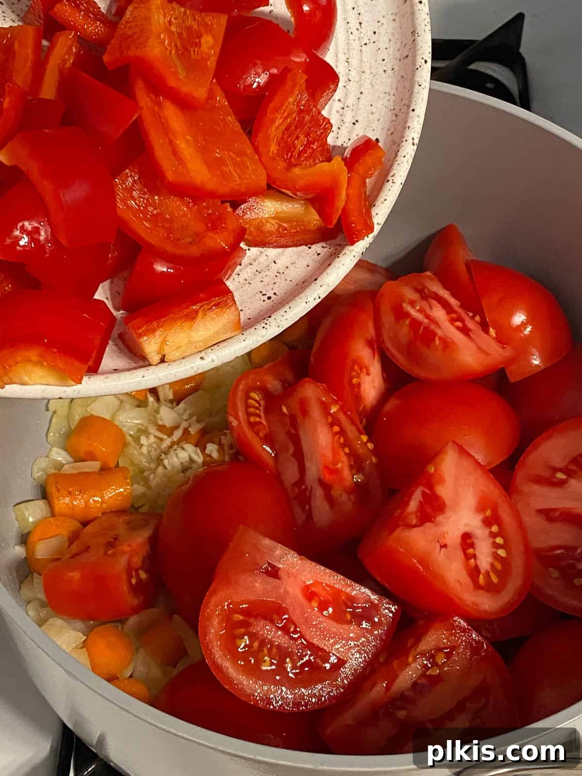 Velvety Vegan Tomato Basil Soup 7 process of adding peppers to pan