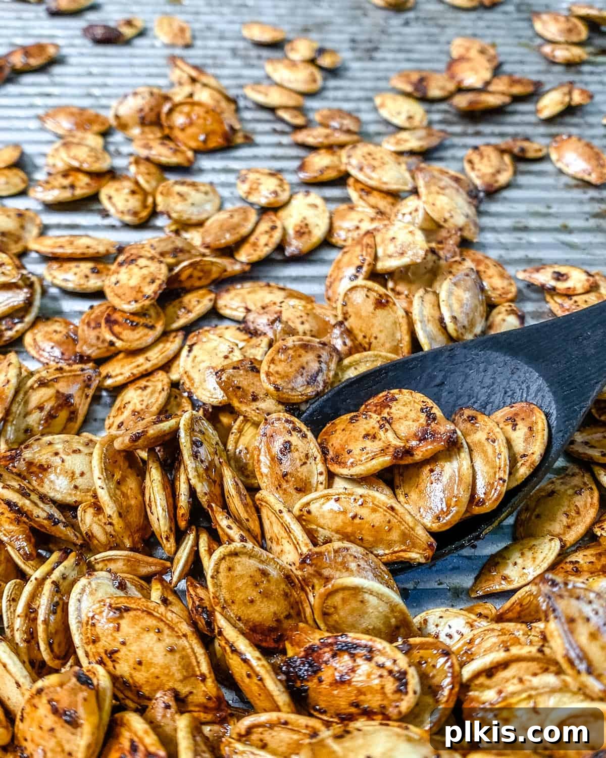 Fiery Roasted Pumpkin Seeds 9 A bowl of roasted spicy pumpkin seeds ready for snacking or storing.