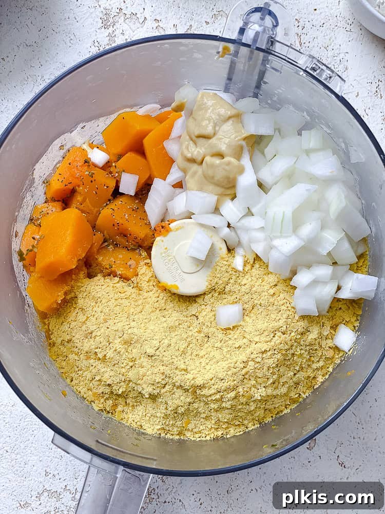 Golden Butternut Macaroni 5 Process shot showing ingredients for the cheese sauce in a food processor, ready to be blended.