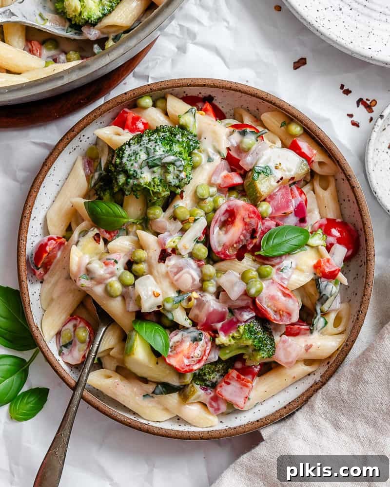 Vibrant Vegan Primavera Pasta 2 A beautifully plated bowl of vegan pasta primavera, showcasing fresh, colorful vegetables and a creamy sauce.