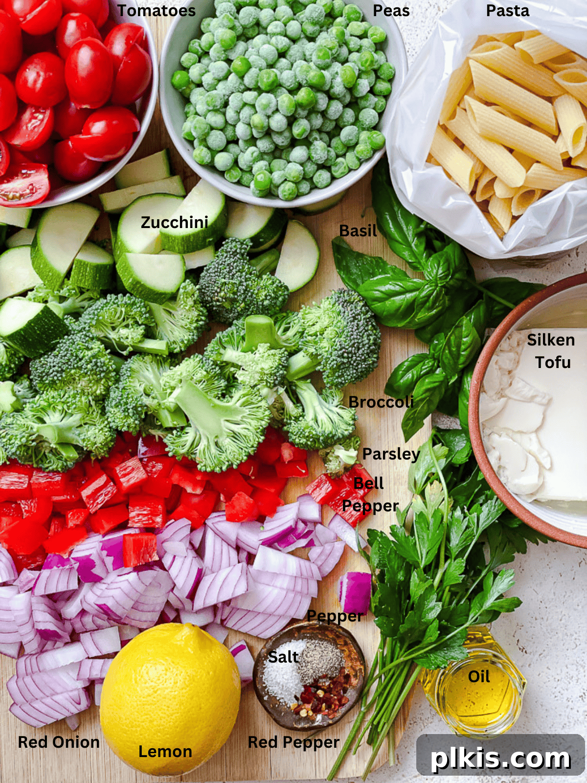 Vibrant Vegan Primavera Pasta 3 A curated display of fresh ingredients for Vegan Pasta Primavera, arranged in individual bowls and ready for cooking.