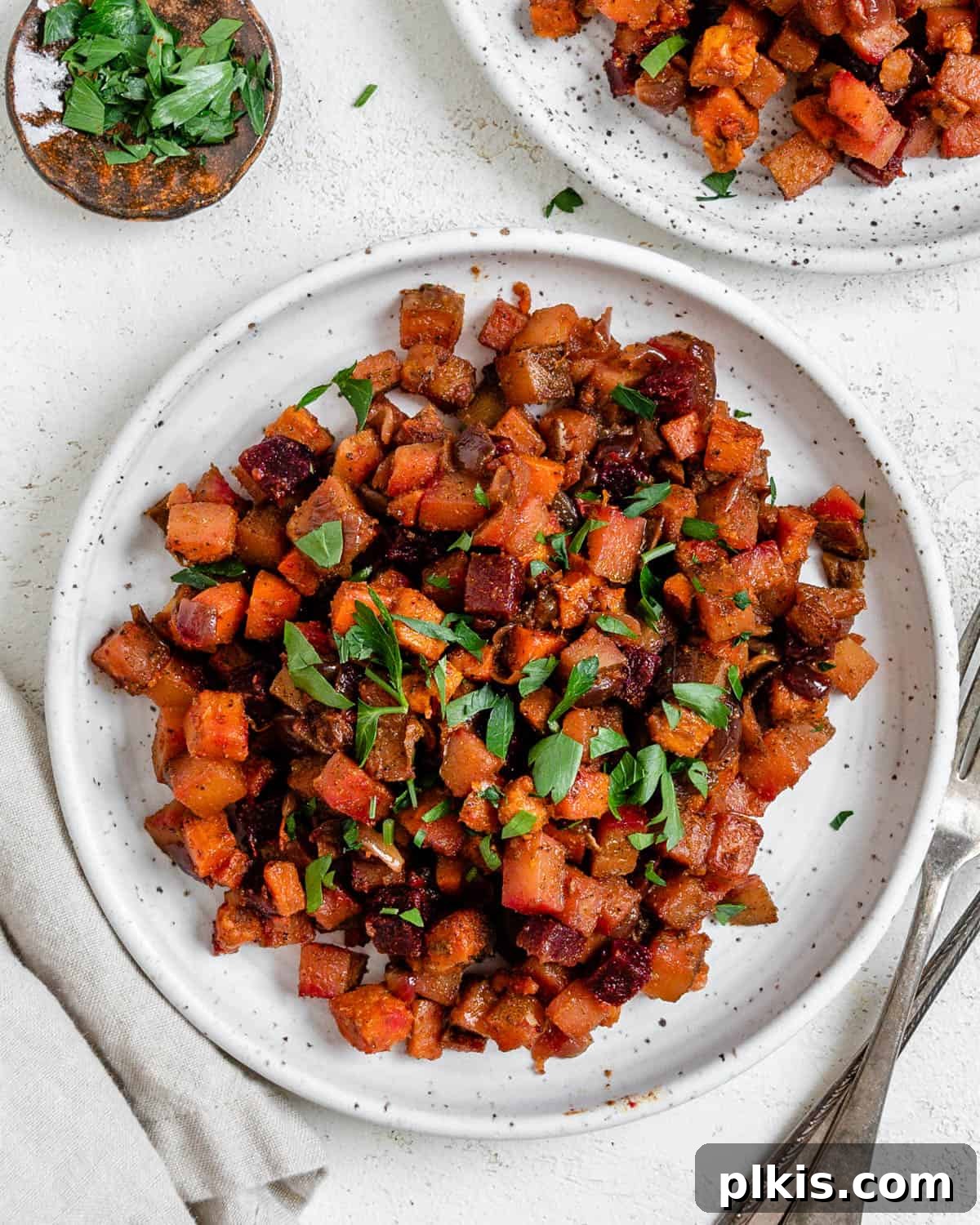 One-Pan Roasted Root Vegetable Medley 2 A delicious One-Pan Root Vegetable Hash plated on a white dish, ready to be enjoyed for breakfast, brunch, or dinner.