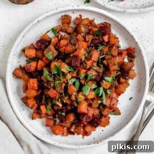 One-Pan Roasted Root Vegetable Medley 10 completed One-Pan Root Vegetable Hash plated on a white plate