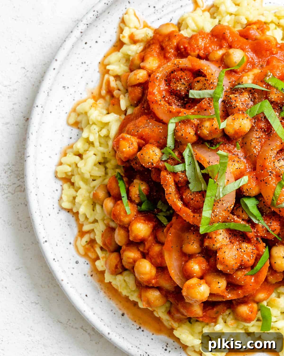 Creamy Tandoori Chickpea Curry Vegan 2 completed Vegan Tandoori Chickpeas plated against a white background