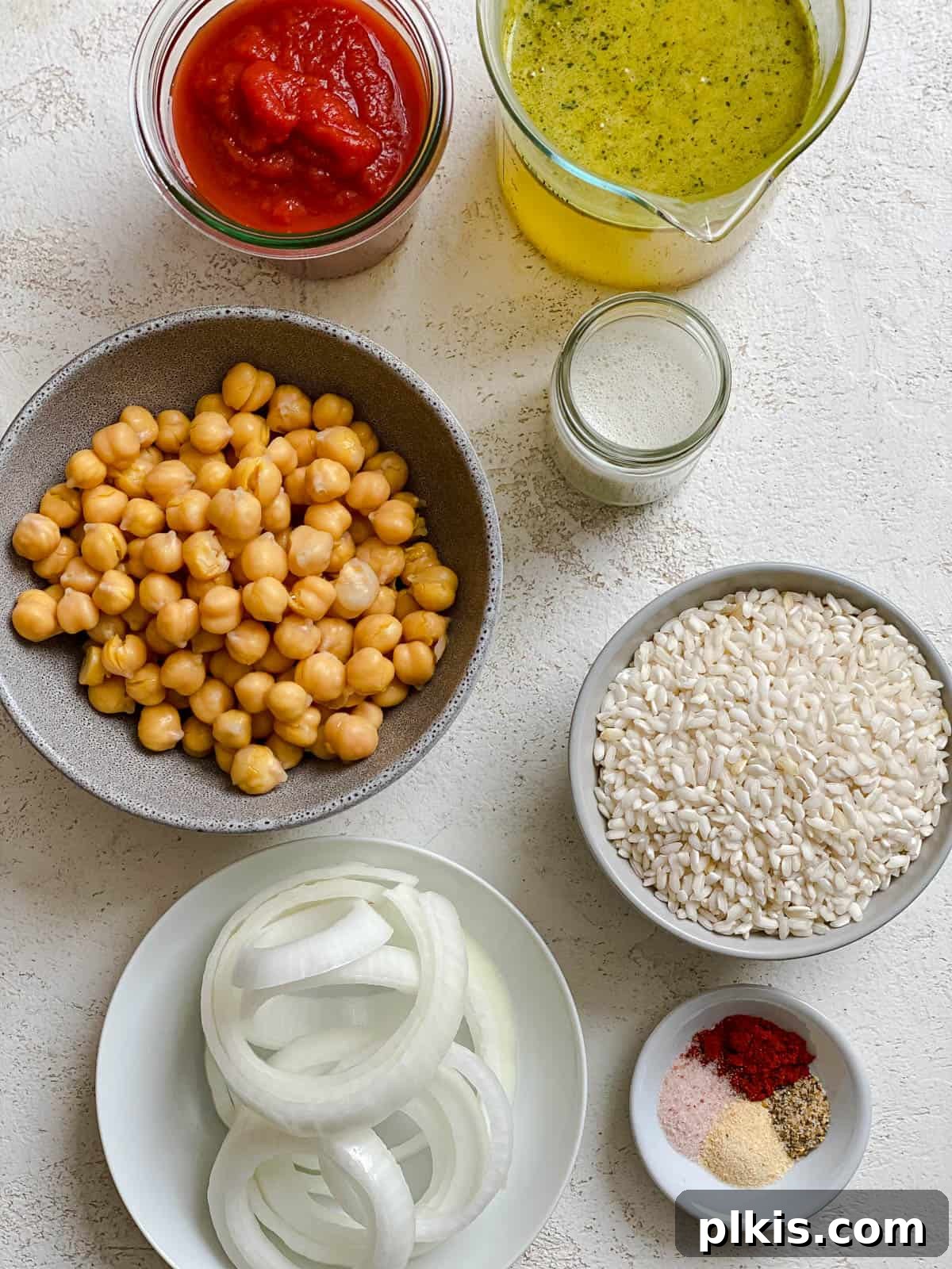 Creamy Tandoori Chickpea Curry Vegan 4 ingredients for Vegan Tandoori Chickpeas measured out against a white surface