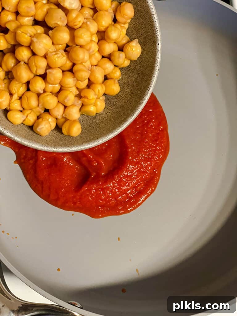 Creamy Tandoori Chickpea Curry Vegan 6 process shot of adding chickpeas to pan