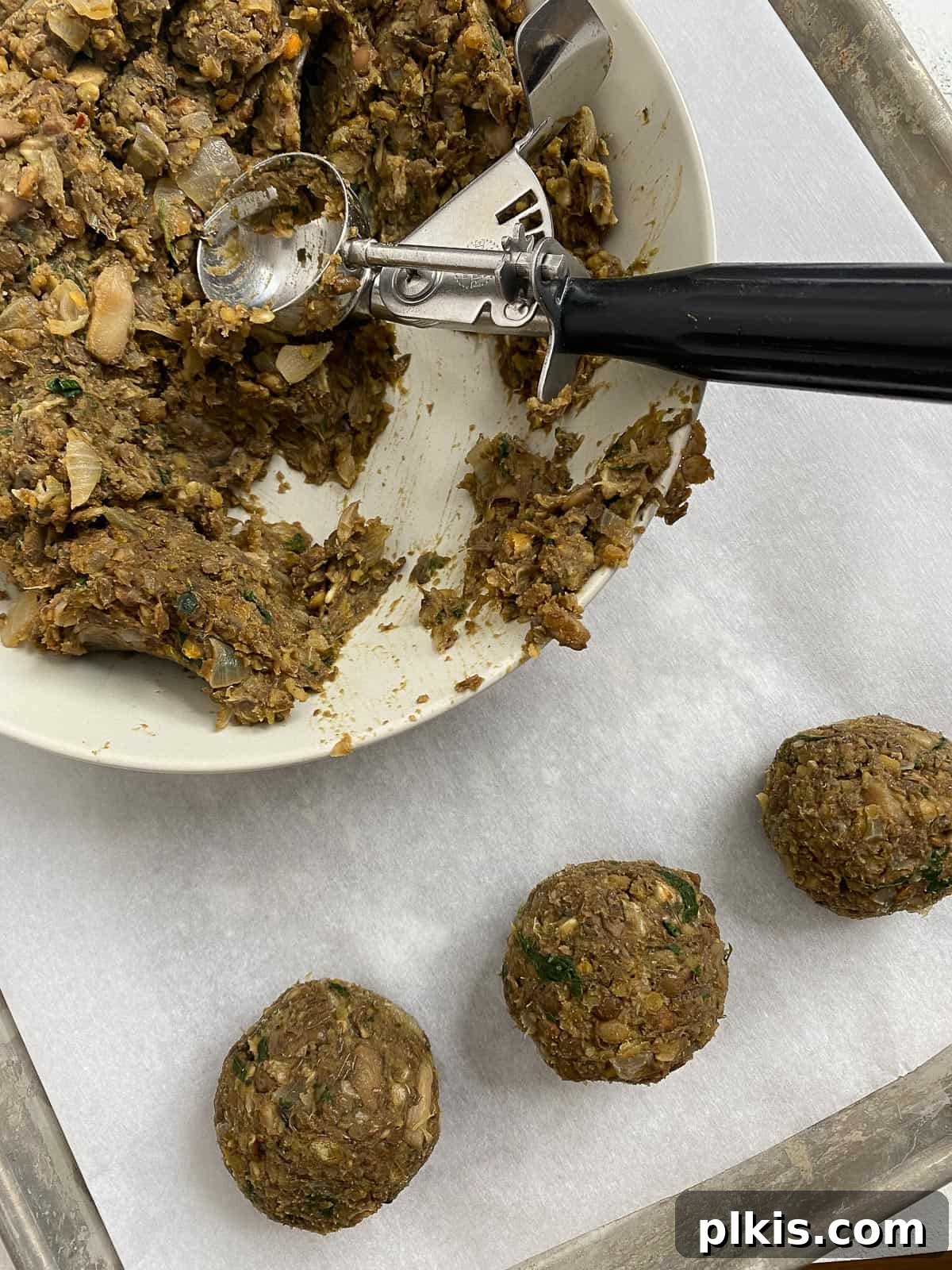 Mighty Lentil Meatballs 15 process shot of creating balls from lentil meatball mixture